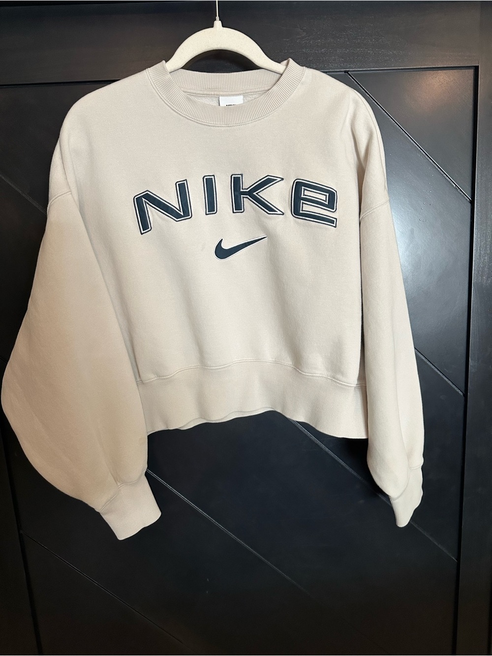 Nike Women's Cropped Crew Sweatshirt in Light Beige with Black Logo